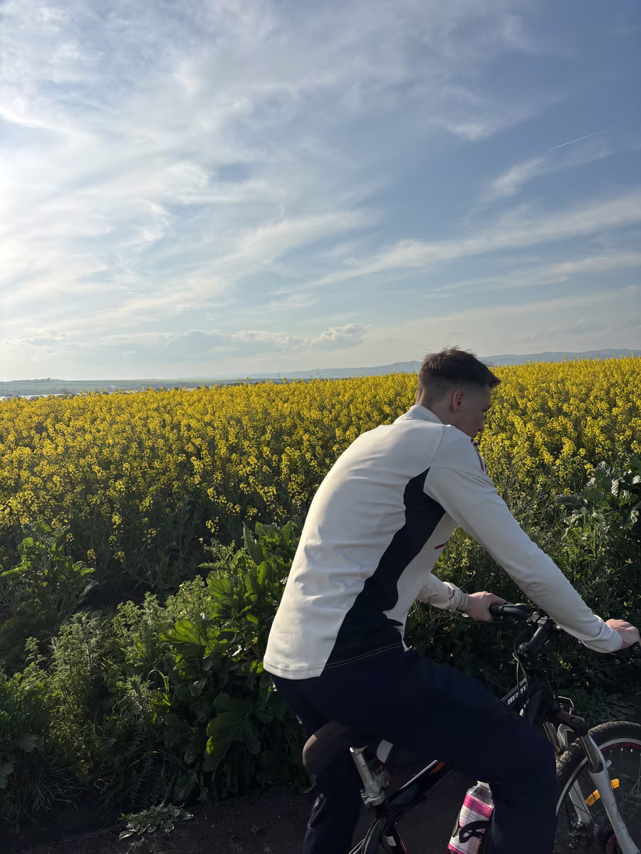 Nikola Nikolov cycling through countryside near Burgas on a rest day, active recovery